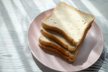 toast breads on pink plate in close-up