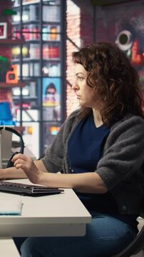 Vertical Video Female programmer developing app and software algorithm on pc, working at creative agency. Engineer uses digital tools and focuses on java script engineering and coding, IT specialist