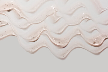 Cream gel peach pink beige transparent cosmetic sample texture with bubbles