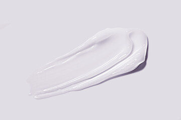 Face or eye white cream hair balm lilac background. Cosmetic skin care beauty product