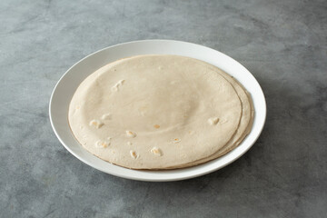 A view of a plate of flour style gluten free tortillas.
