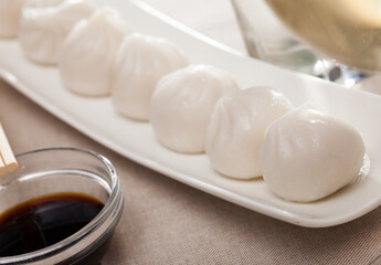 Plate of appetizing steamed dim sum – traditional Chinese dish