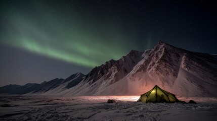 Fototapeta premium A glowing tent beneath the northern lights in a tranquil mountain setting, capturing nature's serene beauty under the night sky. 