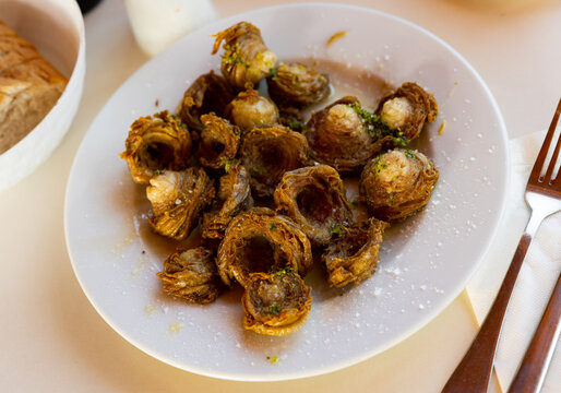 Just cooked portion of madejas aragones, served on table in restaurant.