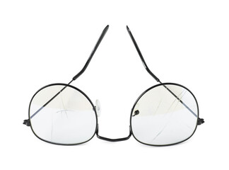 Eyeglasses with broken lens isolated on white