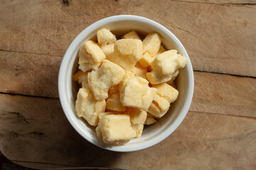 A top down view of a bowl of crunchy mochi snack.