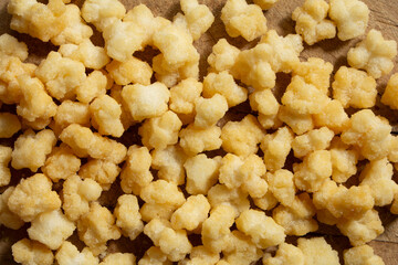 A top down view of a pile of crunchy mochi snack.