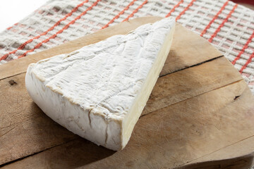 A view of a block of brie cheese.
