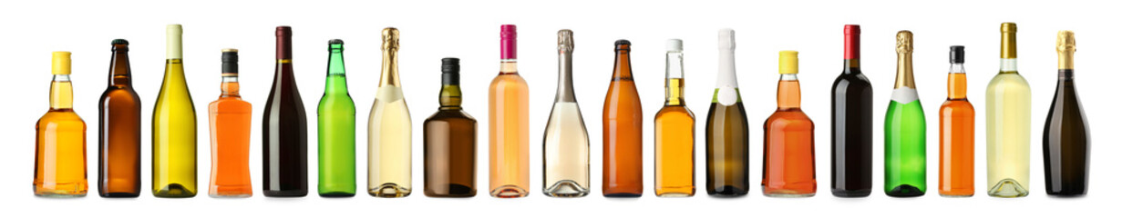 Bottles with different types of alcoholic drinks isolated on white, set