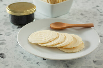 A view of a plate of gluten-free water crackers.