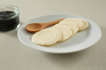 A view of a plate of gluten-free water crackers.