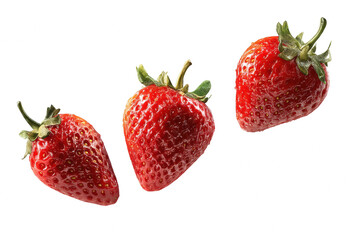 Three juicy red strawberries falling against food ripe diet fruit sweet on transparent background