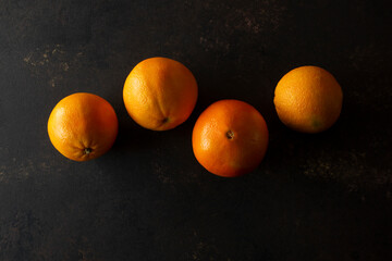 A top down view of some navel oranges.