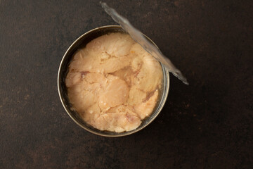 A top down view of a can of pink salmon.