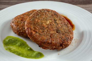 A closeup view of a plate of aloo tikki.