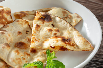 A closeup view of a plate of tandoori roti.
