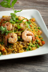 A view of a plate of shrimp fried rice.