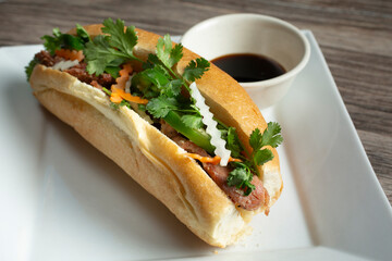 A view of a grilled pork banh mi sandwich.