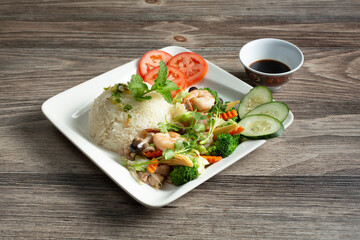 A view of a plate of broken rice and shrimp.