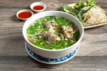 A view of a bowl of oxtail pho.