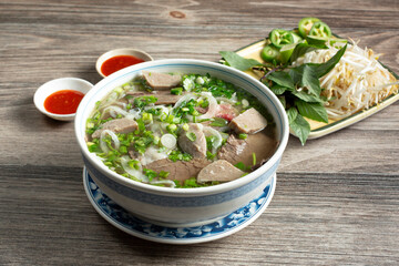 A view of a bowl of pho dac biet.