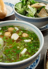 A view of a bowl of seafood pho.