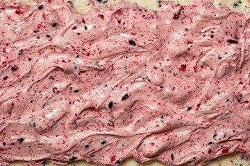 Pink frosting swirls on cake