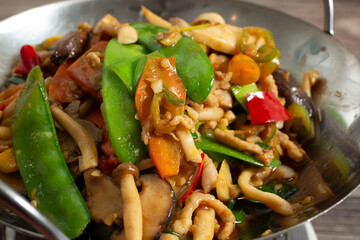 A closeup view of dry mushroom hot pot entree.