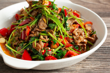 A closeup view of a plate of sauteed lamb.