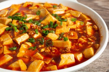 A closeup view of an entree of mapo tofu.