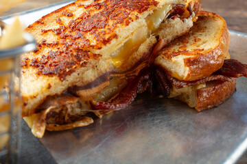 A closeup view of a bacon melt.