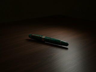 green pen on the table black background