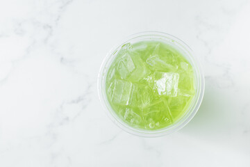 A top down view of a kiwi lemonade.