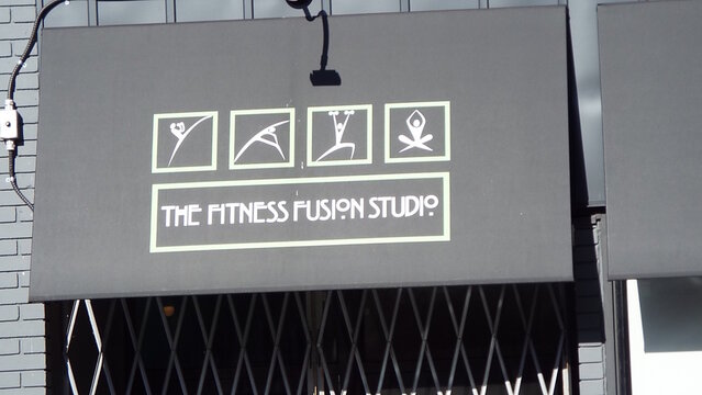 Ottawa, ON, Canada-May 05, 2025: a storefront awning for "THE FITNESS FUSION STUDIO" at 333 Cumberland Street.