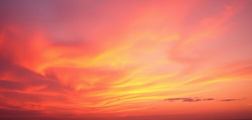 Fototapeta premium Fiery orange, soft pink, and deep purple hues paint the sky during a breathtaking sunset, heavenly, vista
