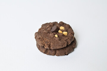 Close up view of two cookies with peanut and chocolate chips. Freshly Baked Homemade. perfect for bakery advertisements and dessert menus. Clipping path. Close up. Stack. Pile.