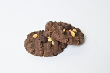 Close up view of two cookies with peanut and chocolate chips. Freshly Baked Homemade. perfect for bakery advertisements and dessert menus. Clipping path. Stack. Close up. Isolated on white background