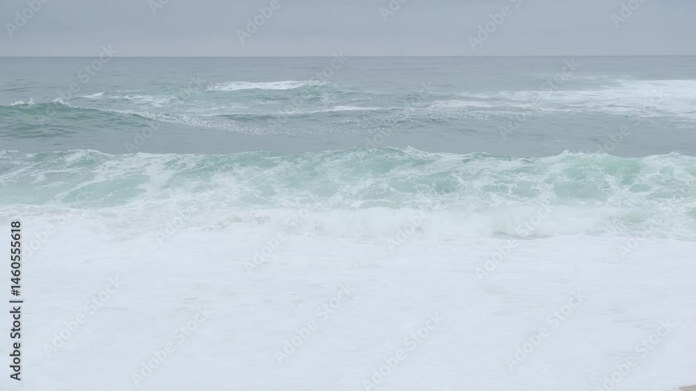 Canvas Prints rhythmic turquoise waves surging against sandy shoreline, generating white foaming patterns and capt
