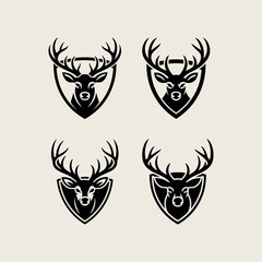 Fototapeta premium Black Deer Head Silhouettes with Antlers Enclosed in Shield Emblems for Logo Design or Wildlife Themed Branding