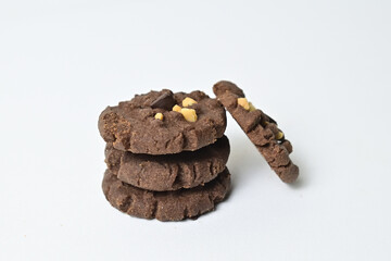 Close up view of four cookies with peanut and chocolate chips. Freshly Baked Homemade. perfect for bakery advertisements and dessert menus. Clipping path. Stack. Pile. Isolated on white background.
