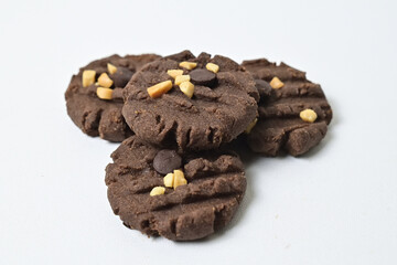 Close up view of four cookies with peanut and chocolate chips. Freshly Baked Homemade. perfect for bakery advertisements and dessert menus. Clipping path. Stack. Pile.