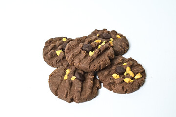Close up view of five cookies with peanut and chocolate chips. Freshly Baked Homemade. perfect for bakery advertisements and dessert menus. Clipping path. Stack. Pile. Isolated on white background.