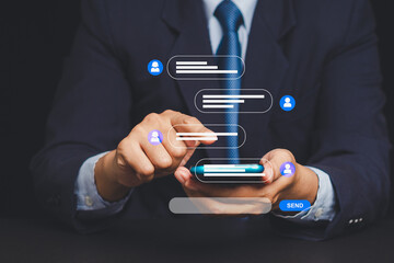 Businessman texting on smartphone with floating chat bubbles, concept of mobile communication.