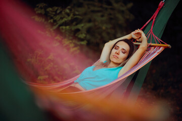 Carefree Woman Sleeping and Resting in a Hammock. Person living in the countryside adopting a slow...