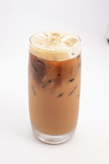 iced coffee with cream and ice cubes served in tall clear glass with foamy top photographed on white background. High quality photo