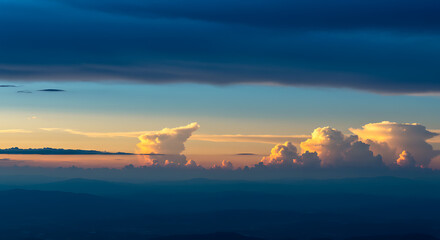 Beautiful sunset over mountains with dramatic clouds