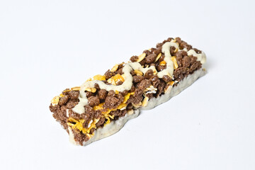 Close up view of Healthy Snack, Cereal Bar, Multigrain Bar with coffee extract isolated on white background. Tiramisu delight. Clipping path.
