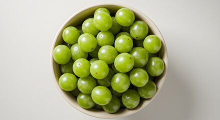 Fresh Whole Grapes in White Ceramic Bowl on White Background