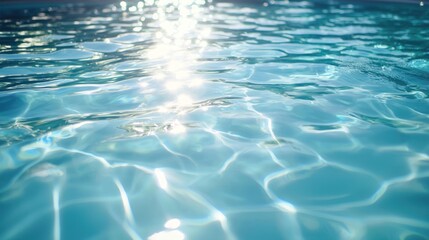 A peaceful outdoor swimming pool with clear blue water and a sunny sky.