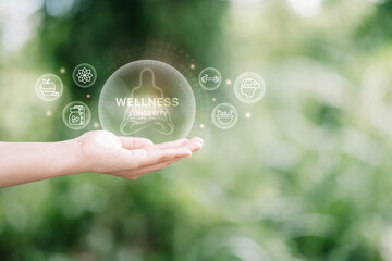Digital wellness icons floating above an open palm. Balance, nutrition, fitness, and self-care concept